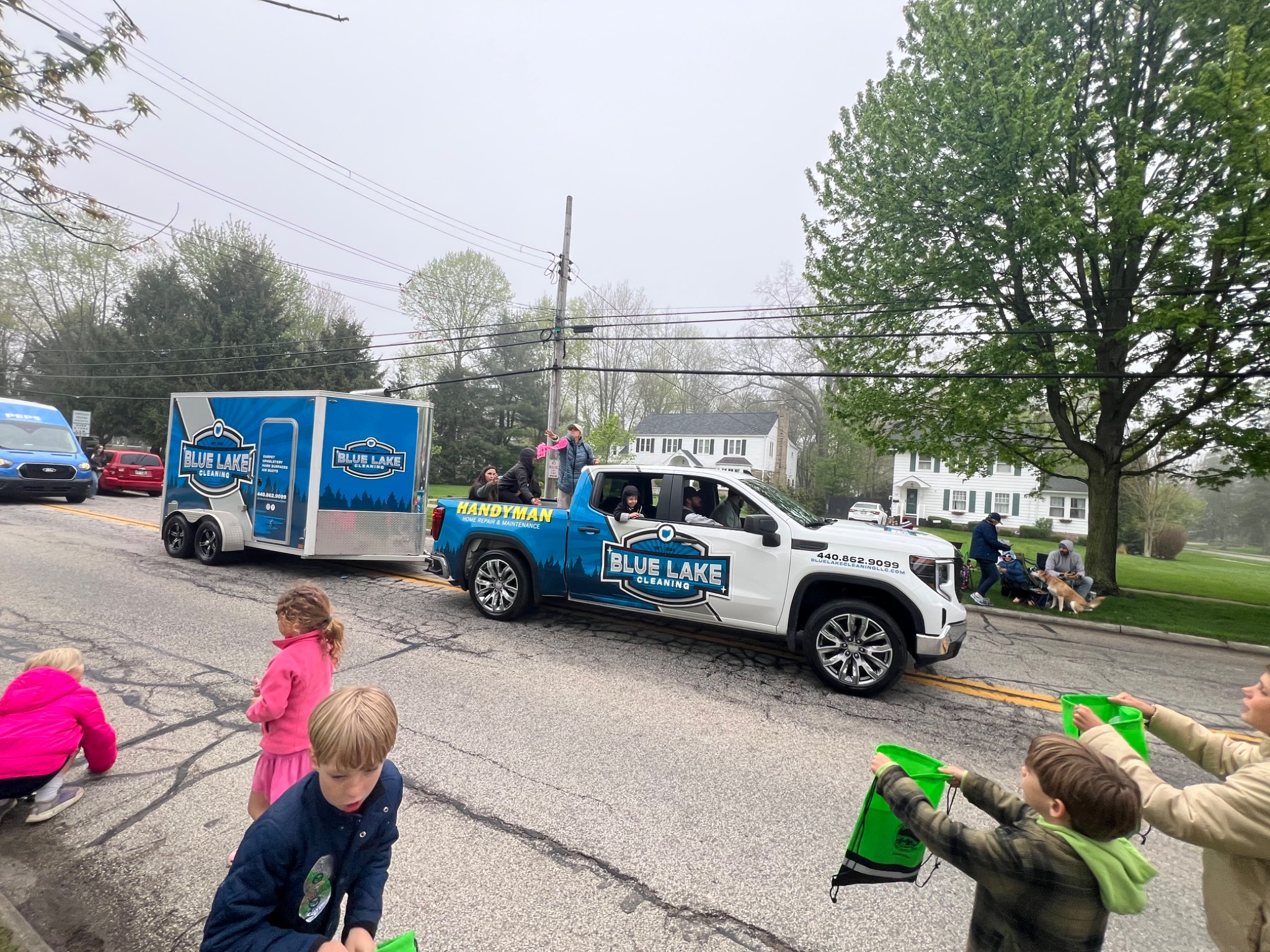 Blue Lake Handyman truck and trailer at a community parade in Northeast Ohio